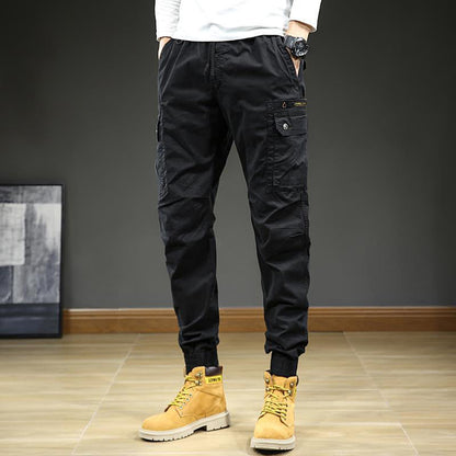 👖 50% RABATT! 🏃 Herr Mode Casual Mjukisbyxor med Flera Fickor – Avsmalnande Passform, Sträcktyg & Perfekt För Sport, Resor & Fritid 🧳 Fri Frakt