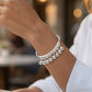 🔔 50% RABATT NU! ✨ Klocka charm armband – Justerbart, silverfinish & lättvikt – Skonsamt ljud & elegant look – perfekt för vardag eller som ett lekfullt statement 💍